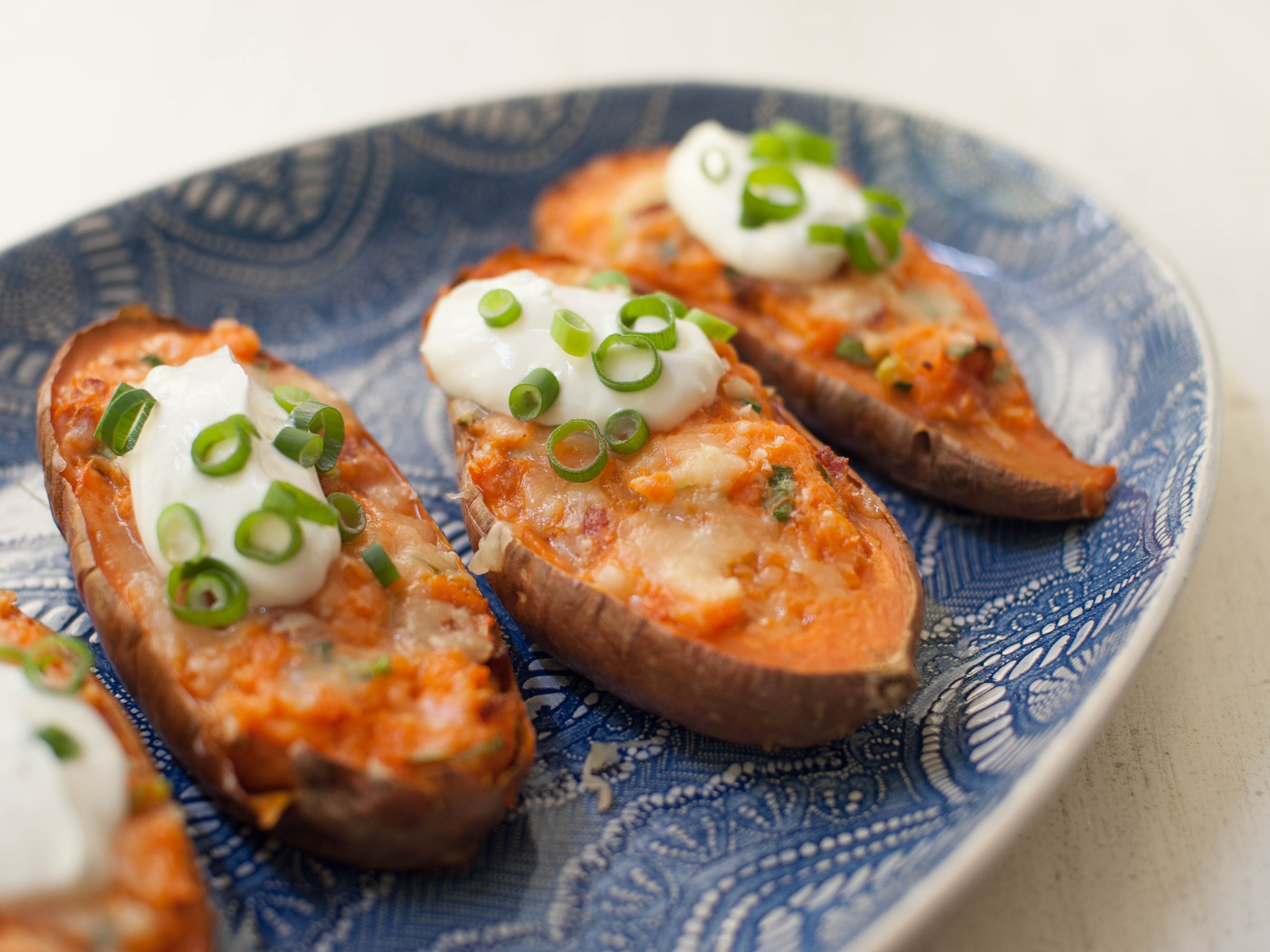 https://www.foodnetwork.com/content/dam/images/food/fullset/2019/5/14/YW1401_Twice-Baked-Maple-Bacon-Sweet-Potatoes_s4x3.jpg